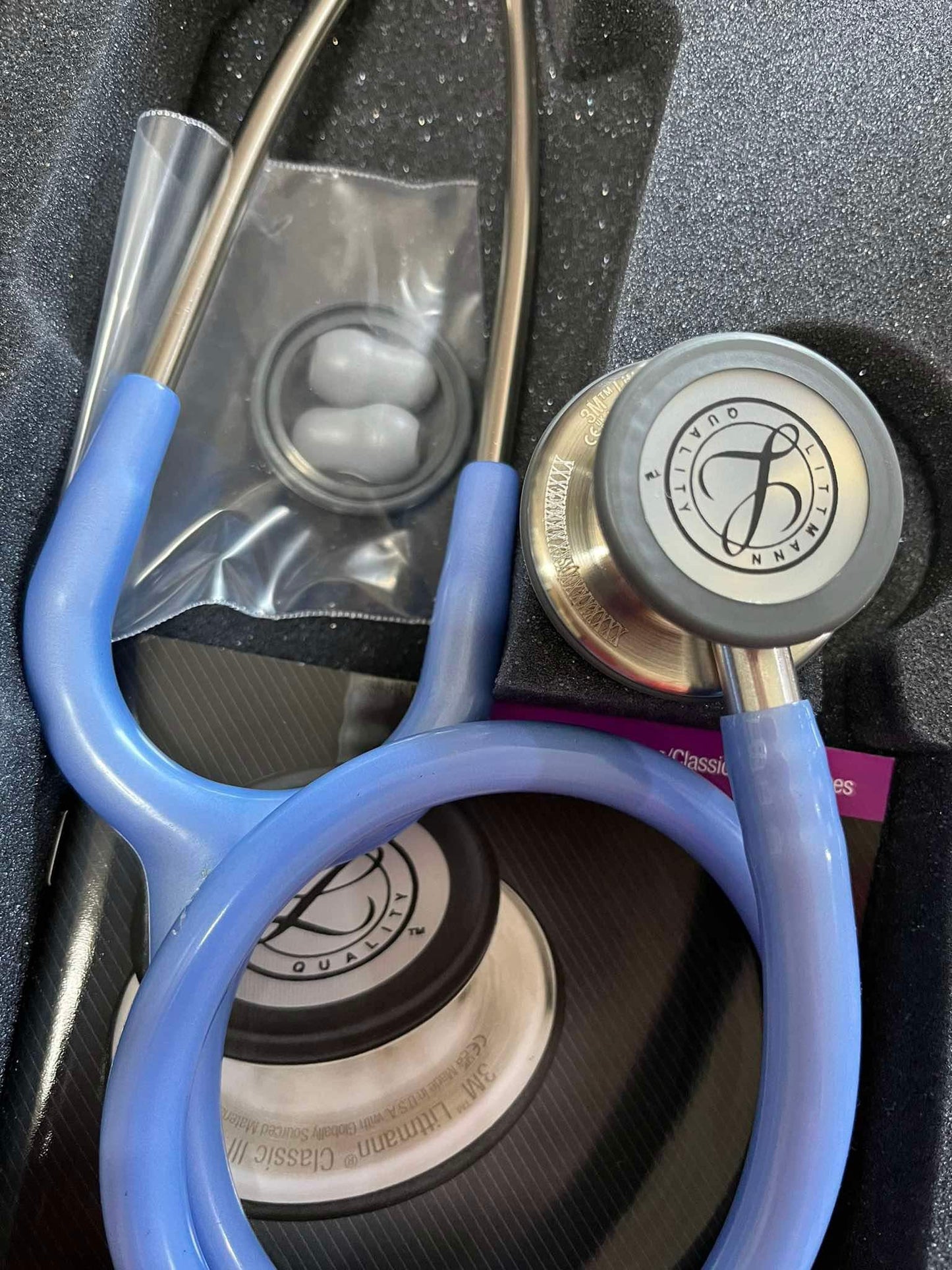 Close-up of Littmann Classic III Stethoscope with mis-engraving on tubing