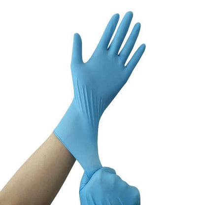 Hand wearing a disposable nitrile glove for hygiene and protection