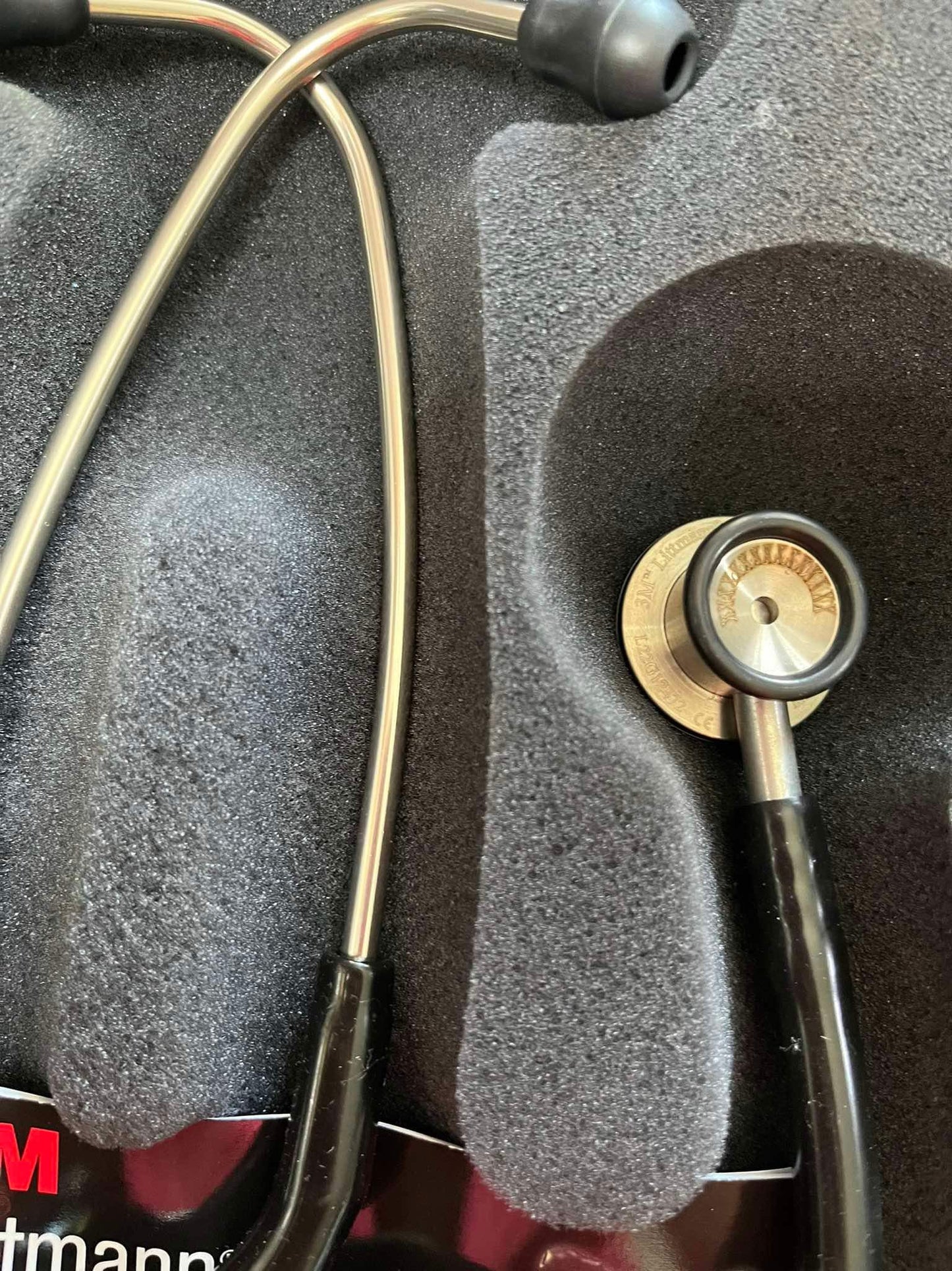 Close-up of Littmann Pediatric Stethoscope Black with mis-engraving on tubing